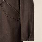 Close-up of the leather texture and construction of the Norcliffe men's brown hooded leather parka.