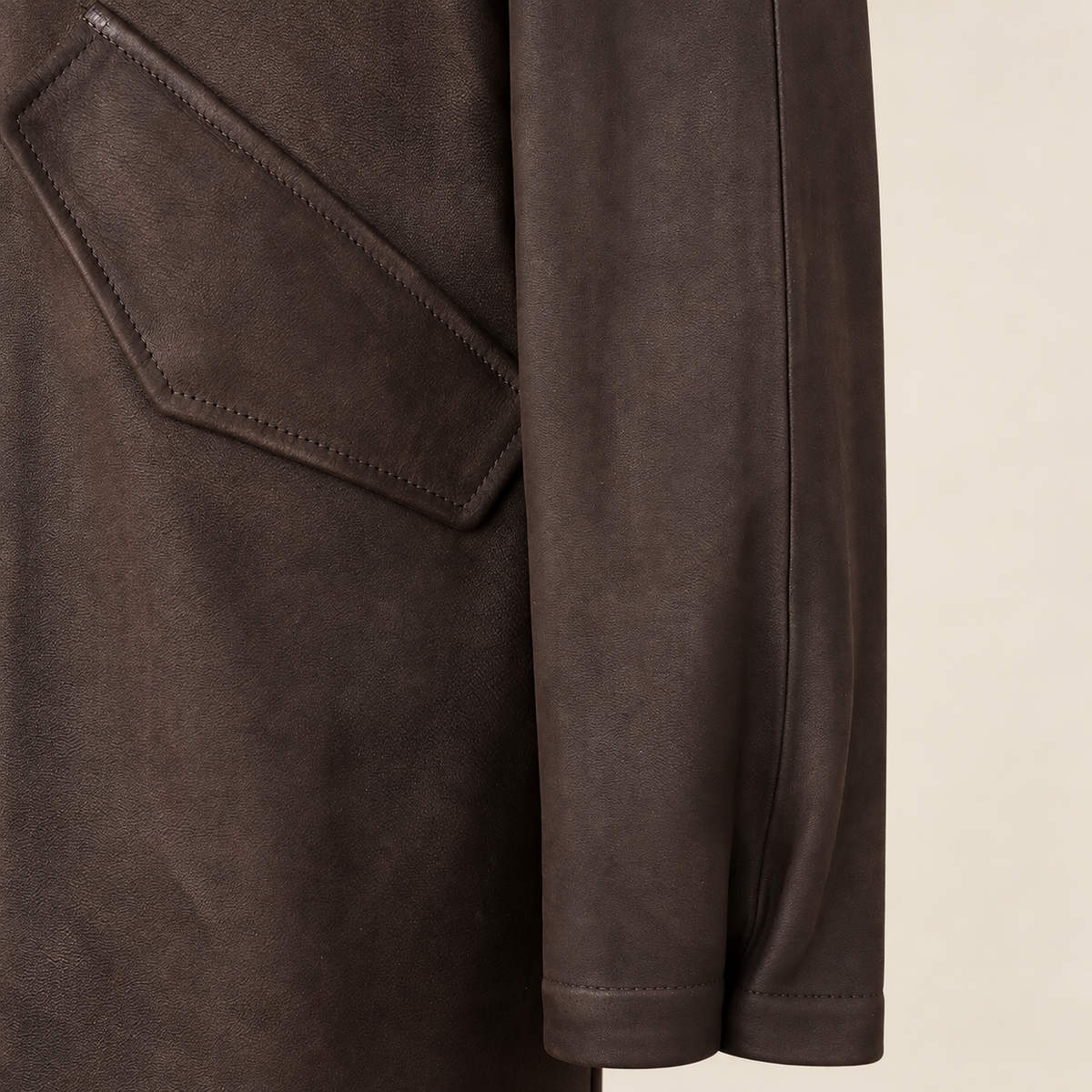 Close-up of the leather texture and construction of the Norcliffe men's brown hooded leather parka.
