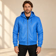 Male model wearing the Northwick Blue genuine leather zip hoodie, front view.