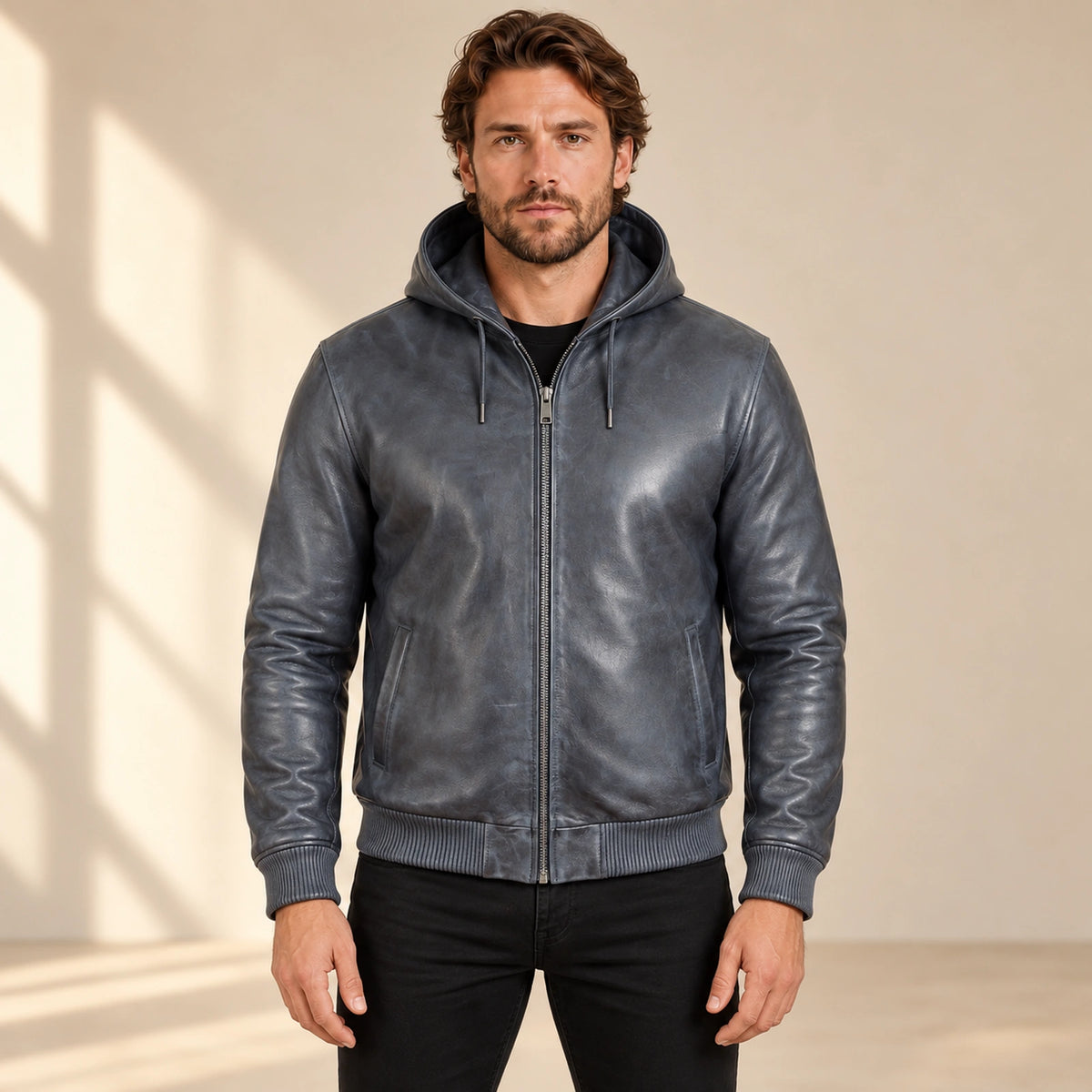 Male model wearing the Northwick Grey genuine leather zip hoodie, front view.