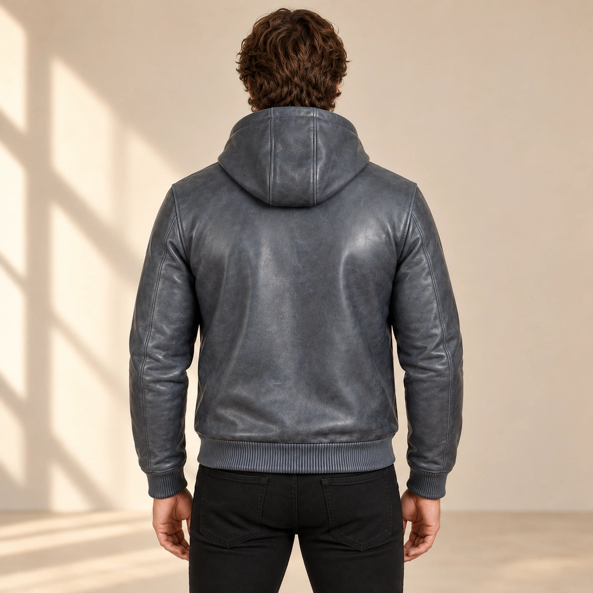 Male model wearing the Northwick Grey genuine leather zip hoodie, back view.