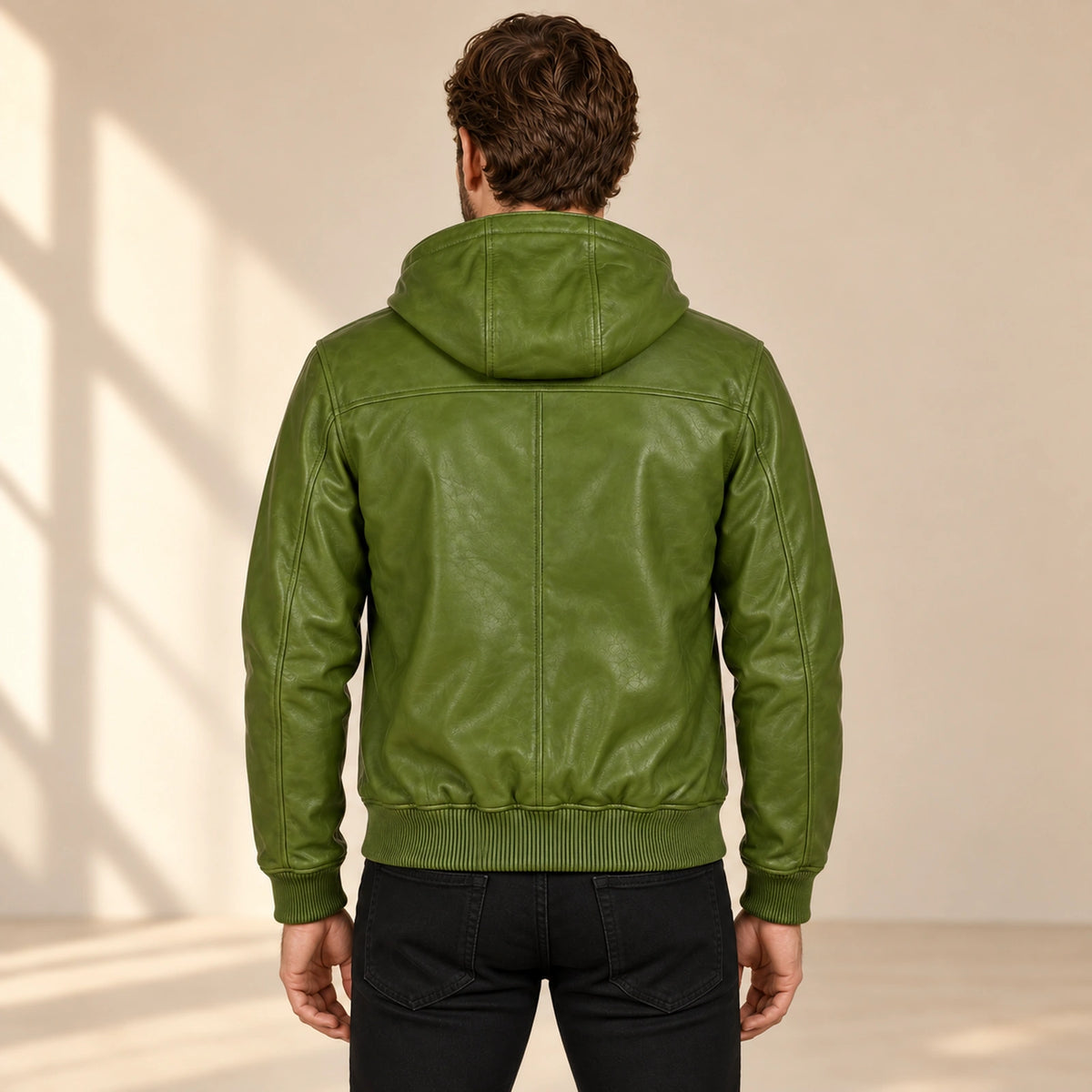 Male model wearing the Northwick Hunter Green genuine leather zip hoodie, back view.