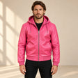 Male model wearing the Northwick Pink genuine leather zip hoodie, front view.