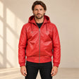 Male model wearing the Northwick Red genuine leather zip hoodie, front view.