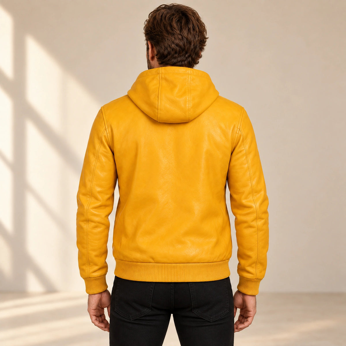 Male model wearing the Northwick Yellow genuine leather zip hoodie, back view.