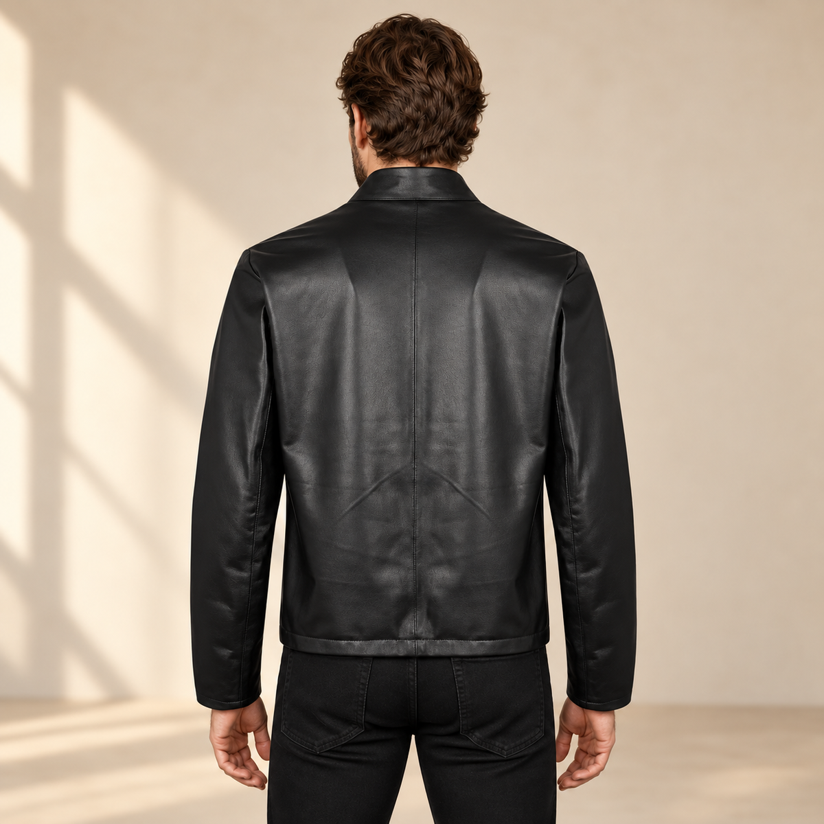 Black men's reversible lambskin leather jacket, model back.