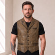 Male model wearing the Ravenscroft Mud vintage waxed lambskin leather waistcoat, front view.
