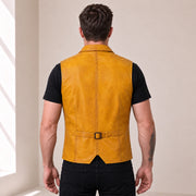 Male model wearing the Ravenscroft Yellow vintage waxed lambskin leather waistcoat, rear view with waist adjuster.