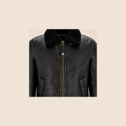 Leather grain and shearling close-up of the Redbourne Men's Black Belted B3 Shearling Bomber Jacket