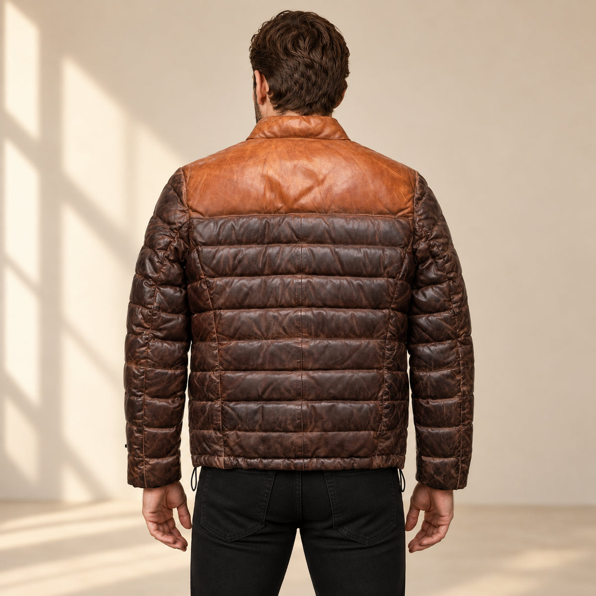 Rear view on the approved male model of the Ridgehaven tan & brown leather down jacket.
