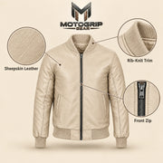 Beige sheepskin leather MA-1 bomber jacket showing leather texture, ribbed trim and front zipper