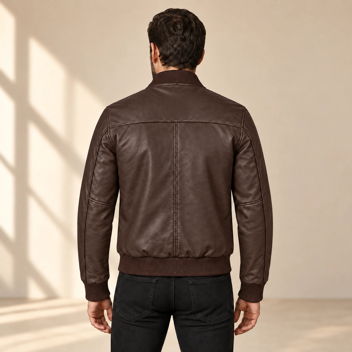 Male model wearing the brown sheepskin leather MA-1 bomber jacket, back view