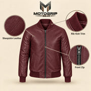 Burgundy sheepskin leather MA-1 bomber jacket showing leather texture, ribbed trim and front zipper