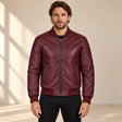 Male model wearing the burgundy sheepskin leather MA-1 bomber jacket, front view