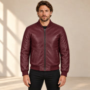 Male model wearing the burgundy sheepskin leather MA-1 bomber jacket, front view