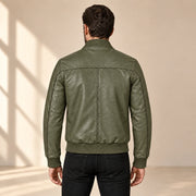 Male model wearing the green sheepskin leather MA-1 bomber jacket, back view