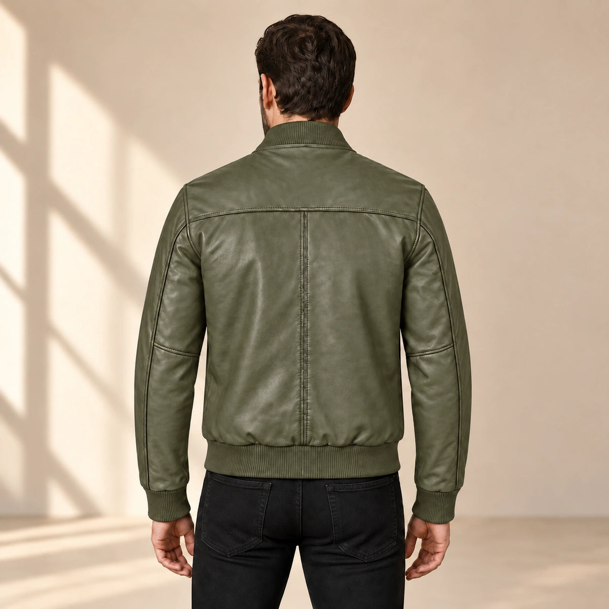 Male model wearing the green sheepskin leather MA-1 bomber jacket, back view