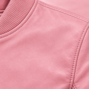 Close-up of pink bomber jacket leather grain and seam stitching