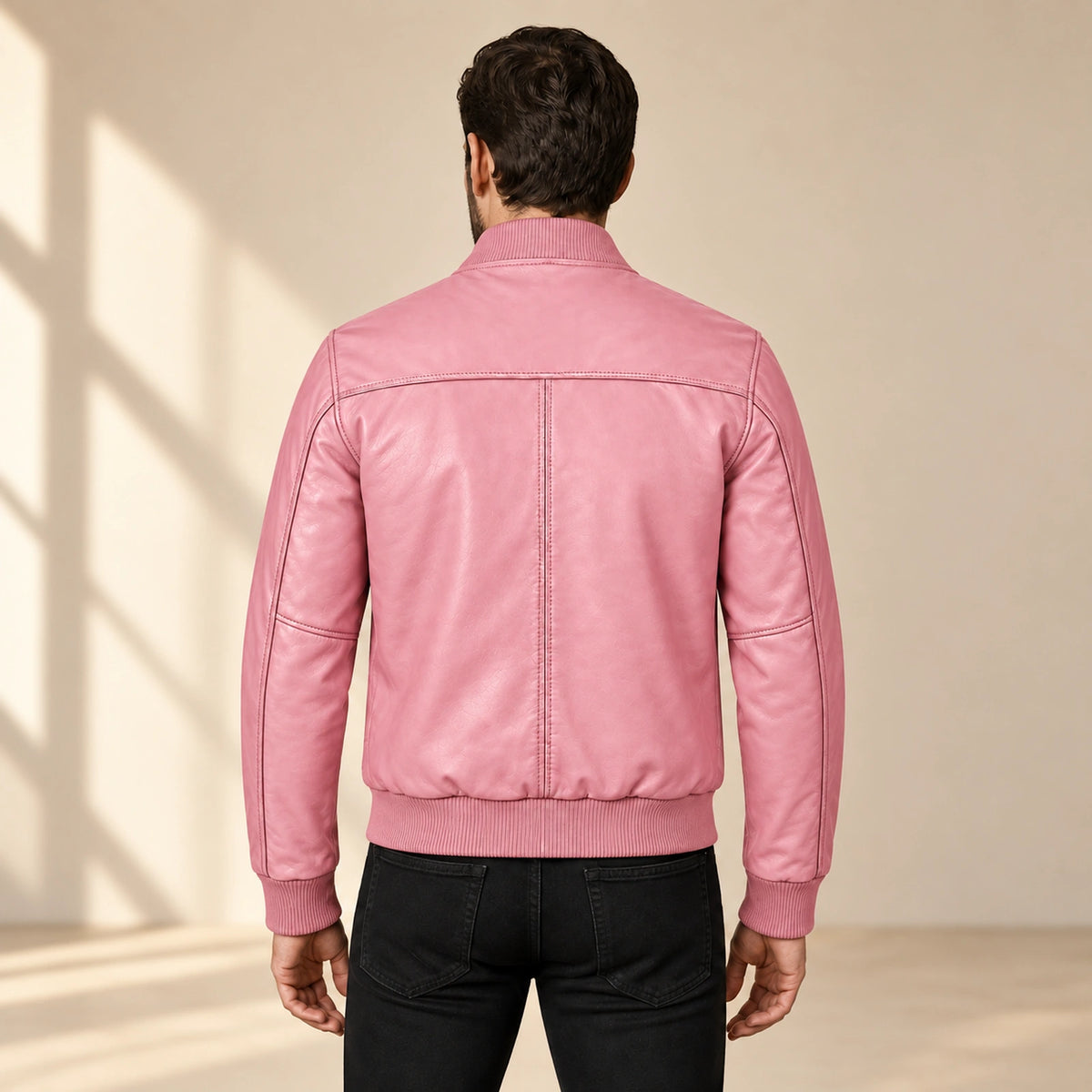 Male model wearing the pink sheepskin leather MA-1 bomber jacket, back view