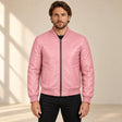 Male model wearing the pink sheepskin leather MA-1 bomber jacket, front view