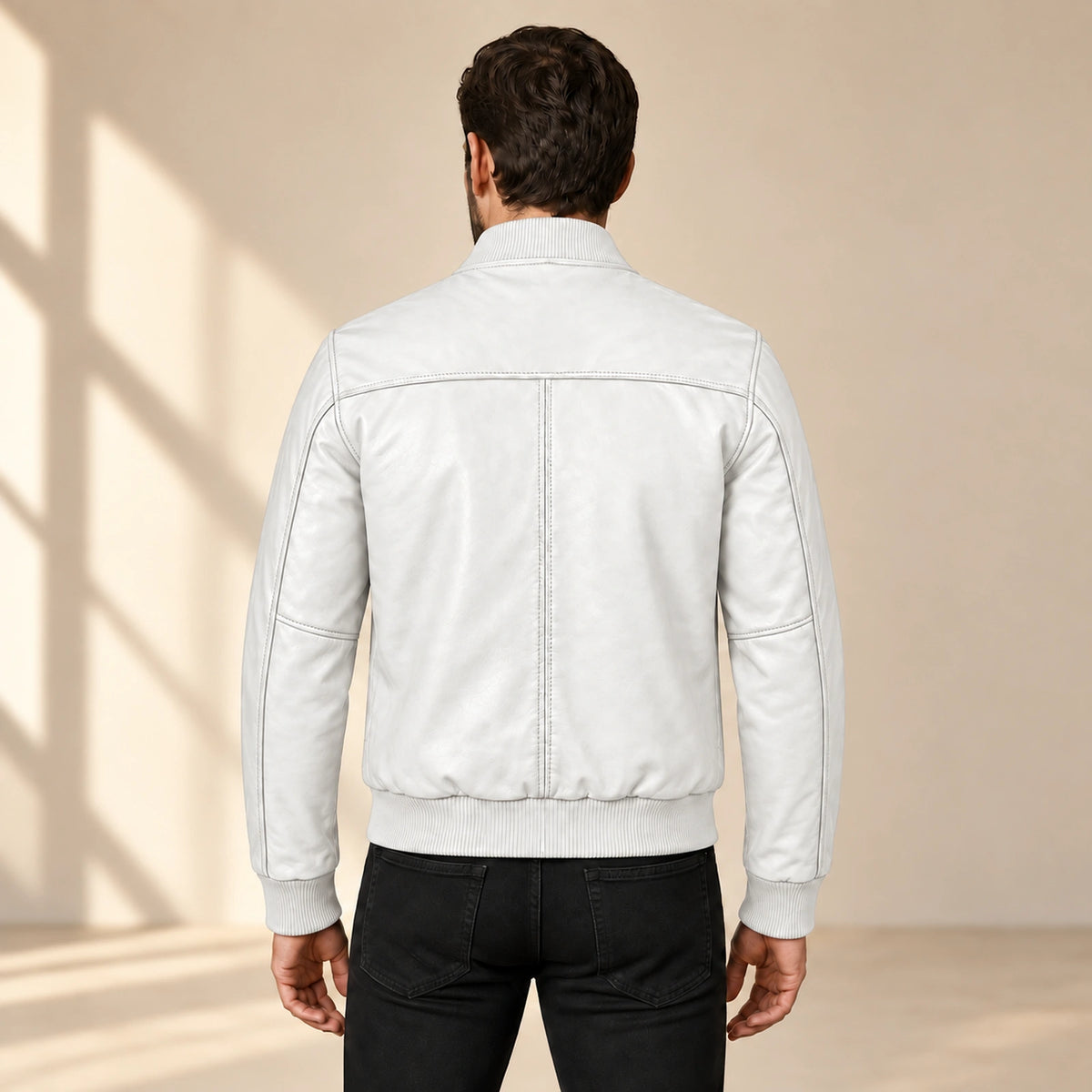 Male model wearing the white sheepskin leather MA-1 bomber jacket, back view