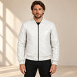 Male model wearing the white sheepskin leather MA-1 bomber jacket, front view