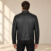 Black men's snap-collar lambskin biker jacket, model back.