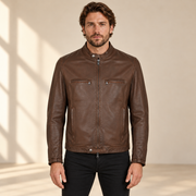 Brown men's snap-collar lambskin biker jacket, model front.