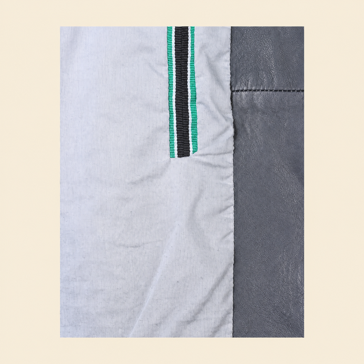 Grey men's snap-collar lambskin biker jacket, inner.