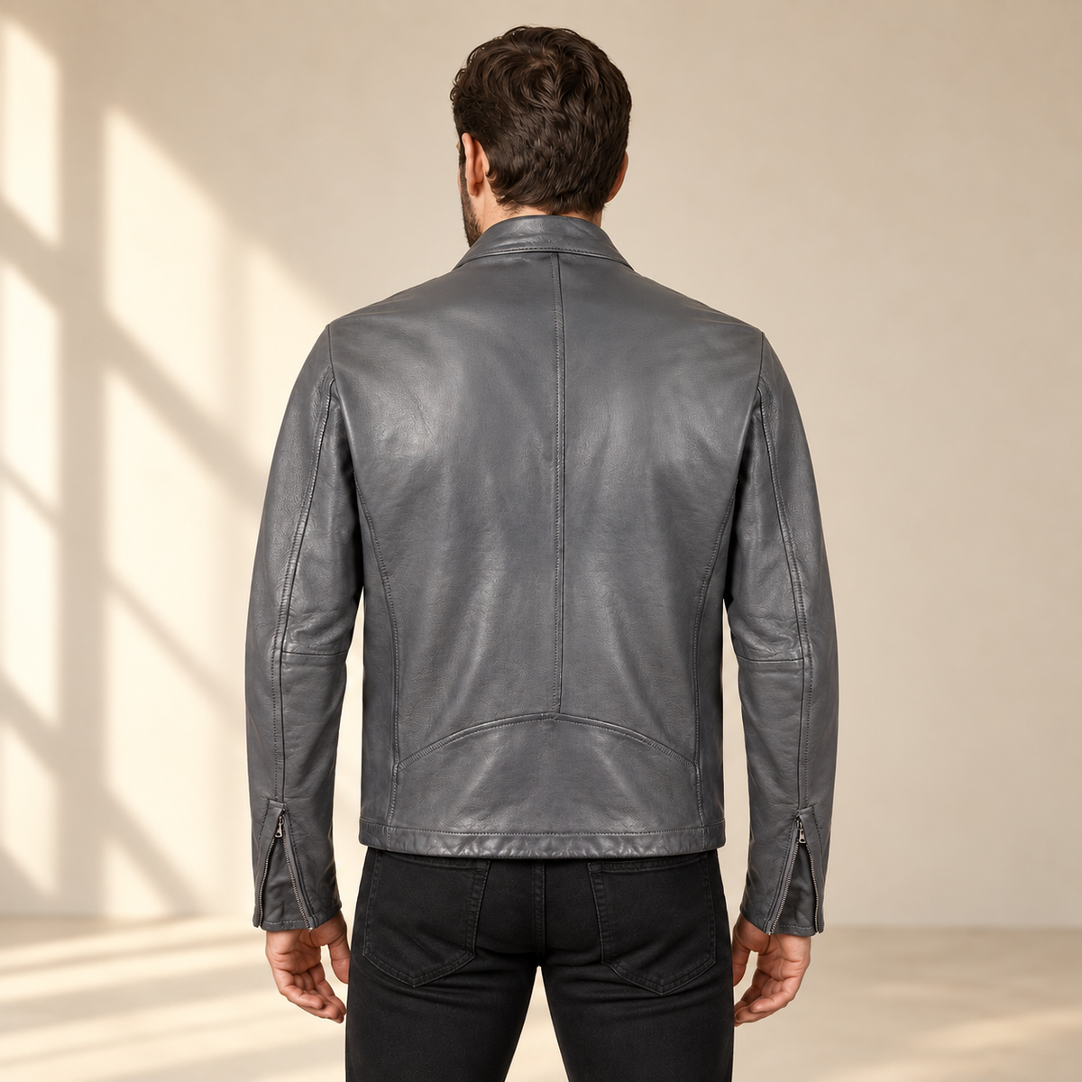 Grey men's snap-collar lambskin biker jacket, model back.