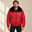 Front model view of the MOTOGRIP red lambskin leather puffer jacket, showing its red body with tonal V stitching.